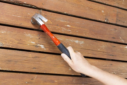Who is responsible for replacing decks after a roof is repaired?
